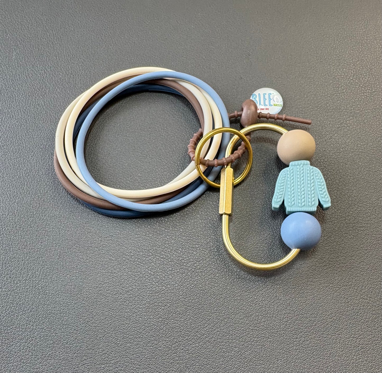BLEE collection with sweater weather carabiner keychain.