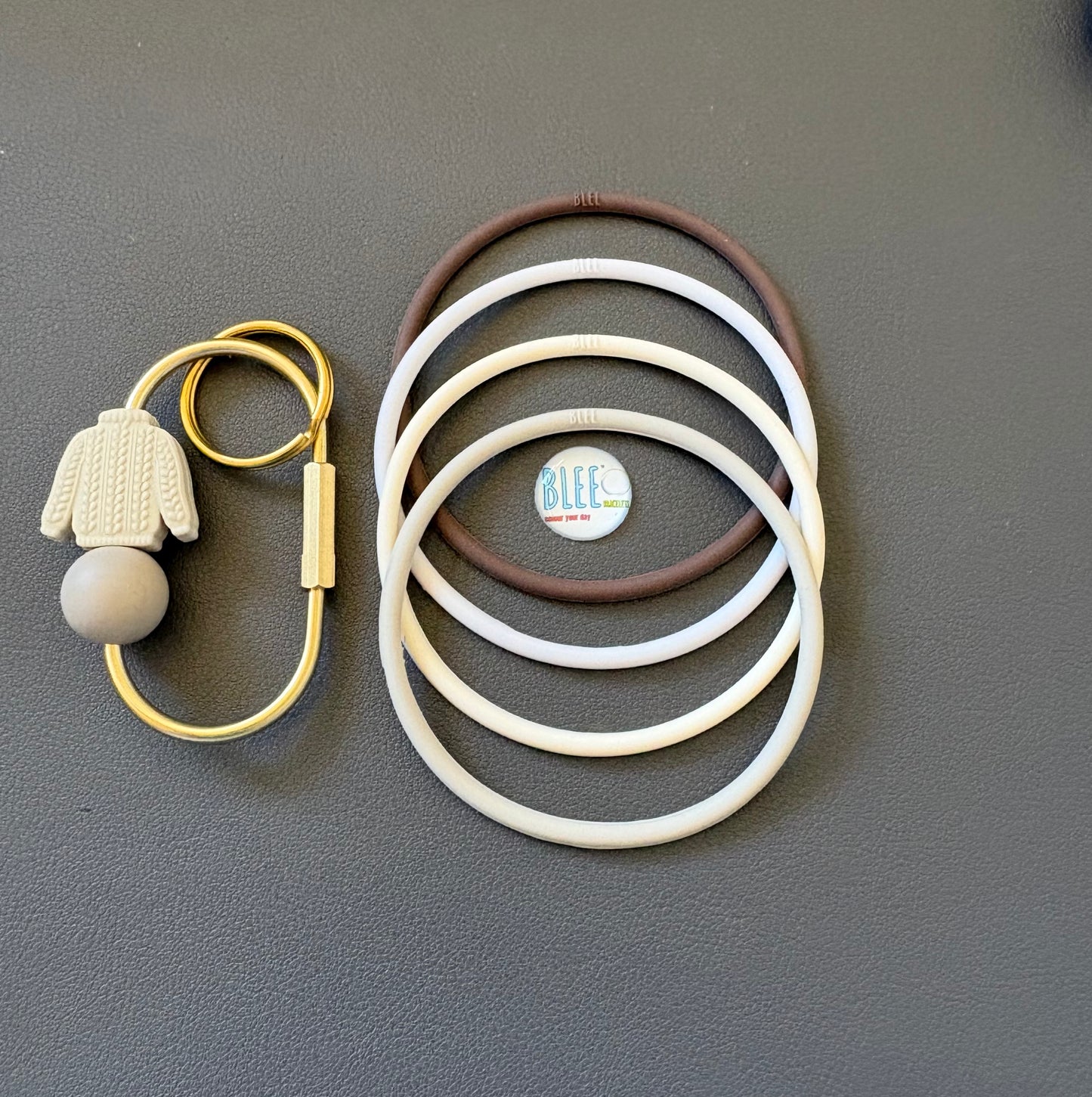 BLEE collection with sweater weather carabiner keychain.