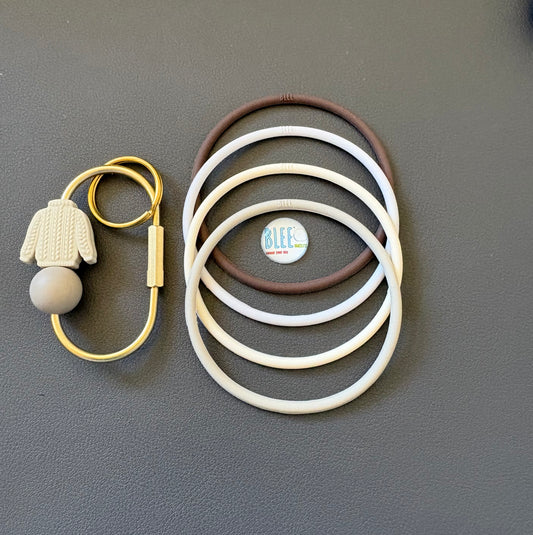 BLEE collection with sweater weather carabiner keychain.